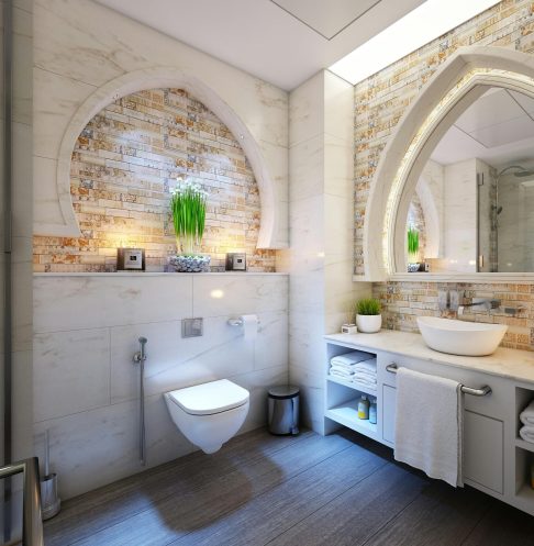 Elegant modern bathroom with marble tiles, ambient lighting, and stylish decor.